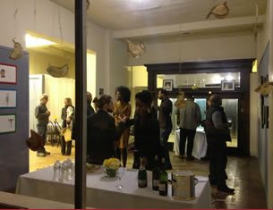 Crowds flow into one of the temporary businesses sparked by REVOLVE's popup program in Detroit's West Village neighborhood.