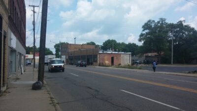 Four lanes of fast traffic coming around the curve on Portage make the Washington Square area an unappealing place to walk or bike.