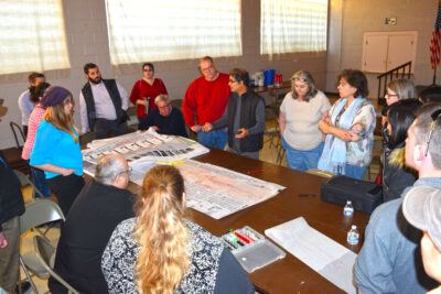 Designer Vinayak Bharne talks with Hazel Park residents about ways to improve their community as part of a CNU Legacy Project Tuesday.