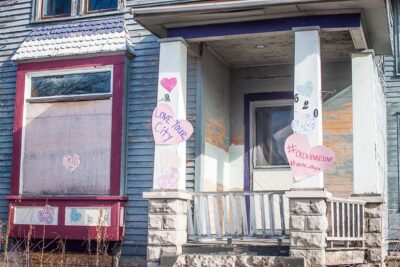 Posting valentines on vacant houses might not fix structural issues, but can help signal to a potential buyer that the community is pulling for them. (Photo courtesy Kristi Kozubel)