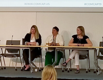 The League's Melissa Milton-Pung (left) speaks during a panel discussion today at ComCap in Detroit.