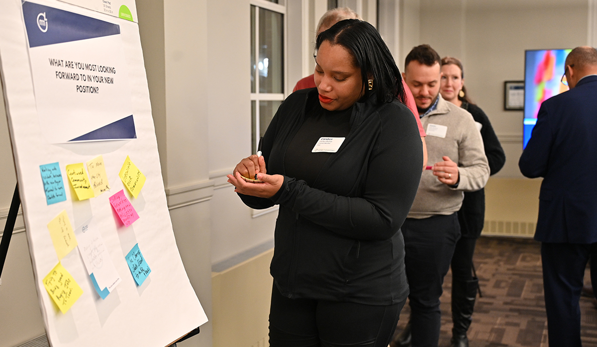 A woman standing in front of a large
