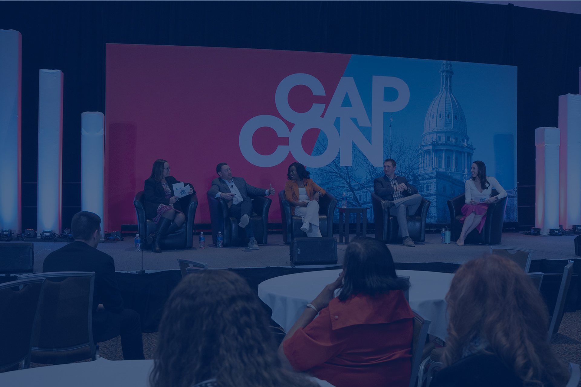 The SFAD team on stage at CapCon 2025.
