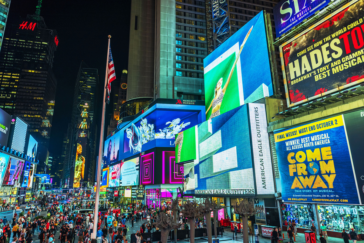 New York. USA. September 20.2022. Beautiful night view of Times Square with glowing billboards crowds and bright city lights.